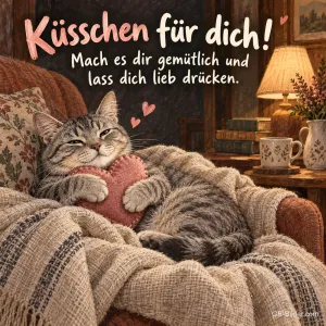 Katze mit Stoffherz im Sessel, Text: Küsschen für dich!
