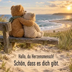 Kuschelnde Teddybären auf einer Bank am Meer, Text: Hallo, du Herzensmensch!