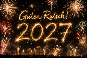 Jahreszahl 2027 aus Funken vor Feuerwerk, Text: Guten Rutsch! – 2027