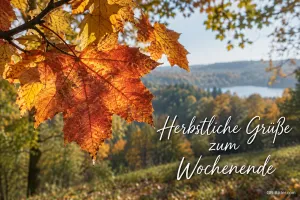 Ahornlaub über einer Herbstlandschaft, Text: Herbstliche Grüße zum Wochenende